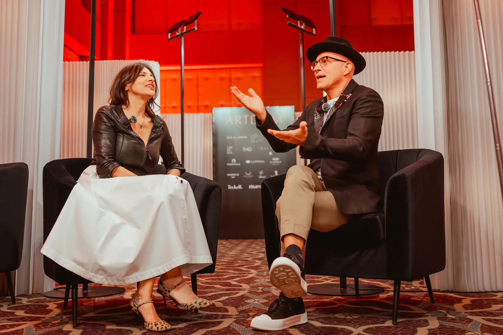 Two speakers in conversation on the ARTDOM stage
