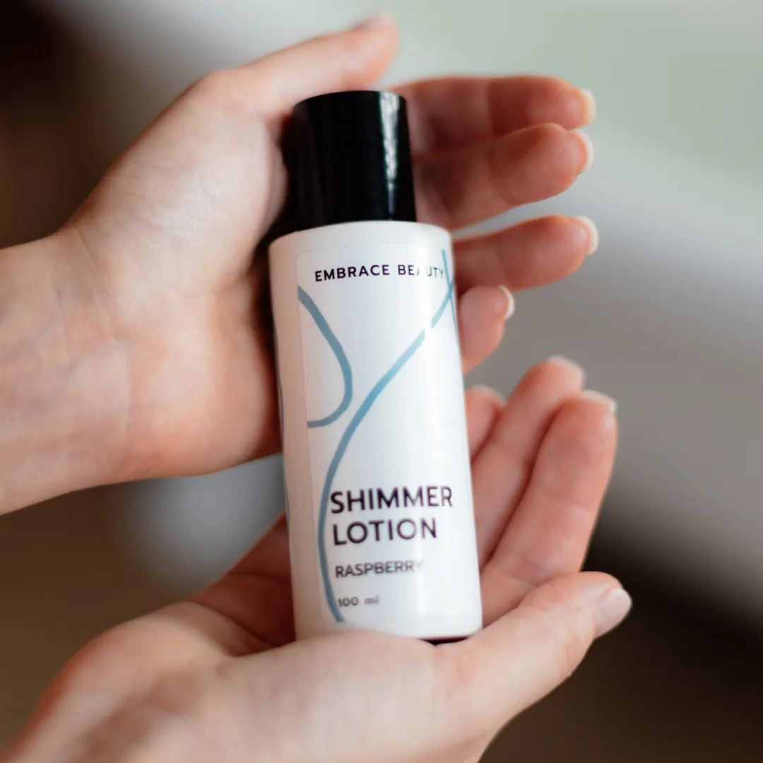 Shimmer lotion held in two hands