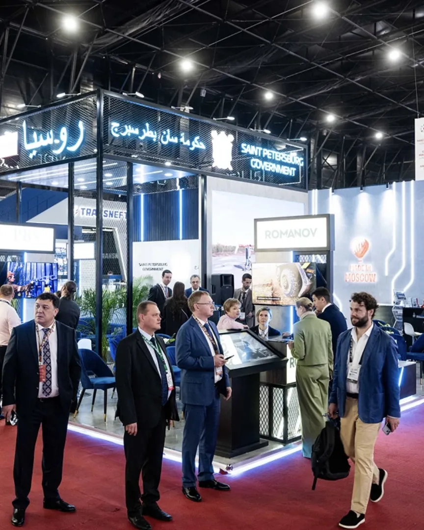 Delegates gathered at a stand on the exhibition floor