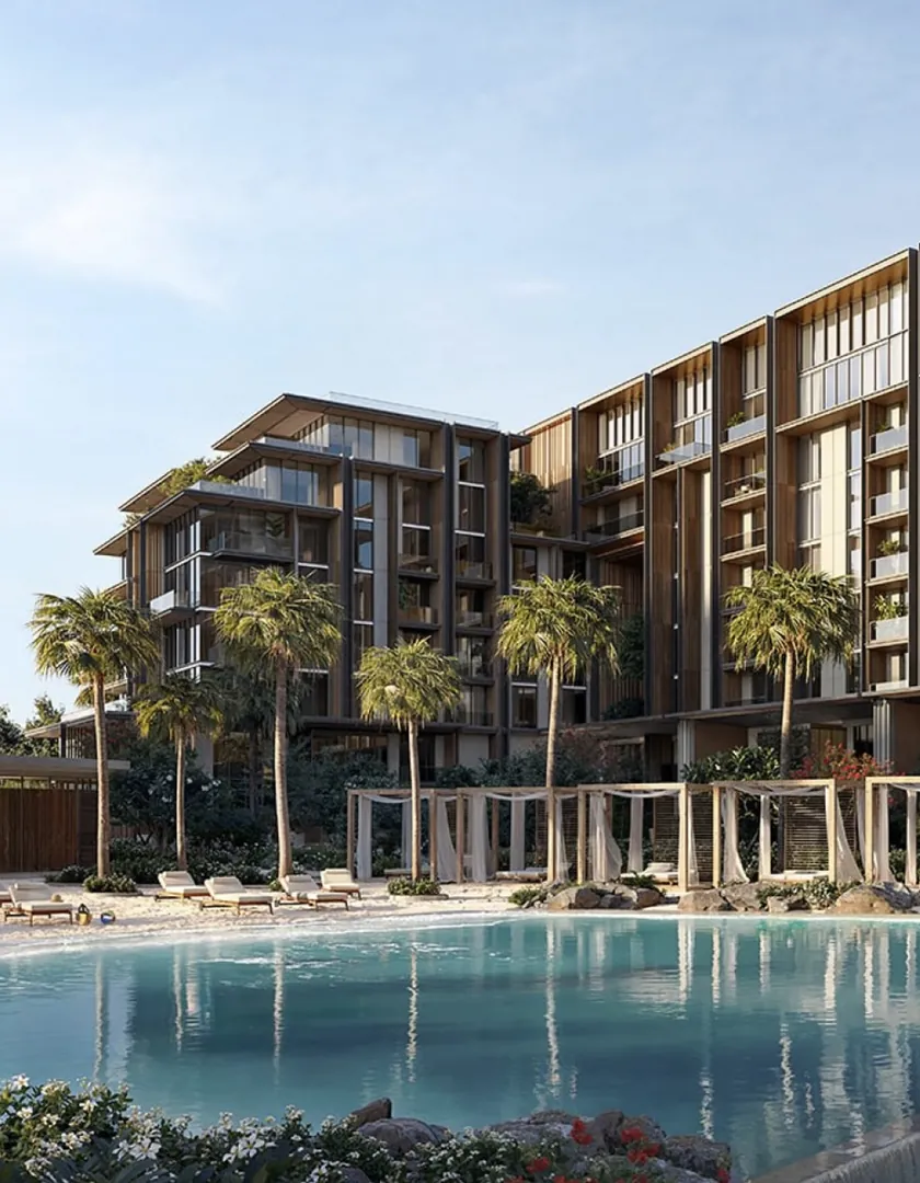 A KRONUNG residence behind a palm-lined pool