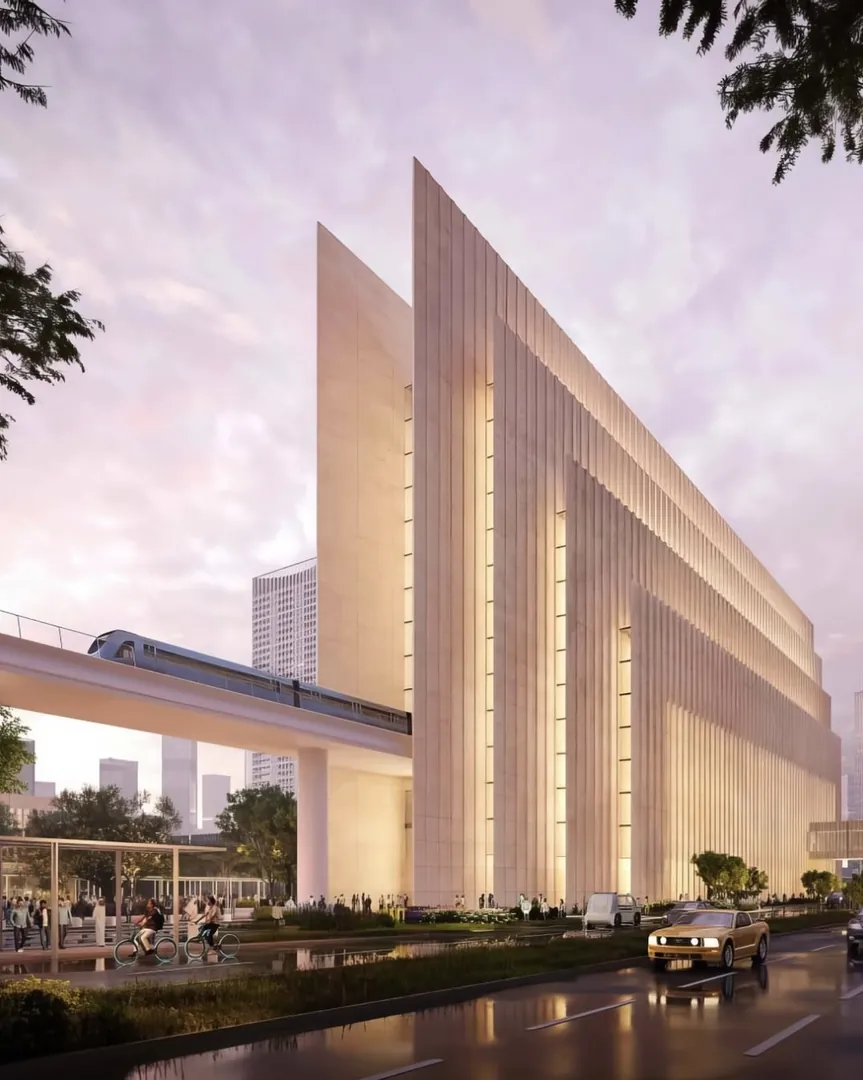 A ribbed facade beside the elevated metro line