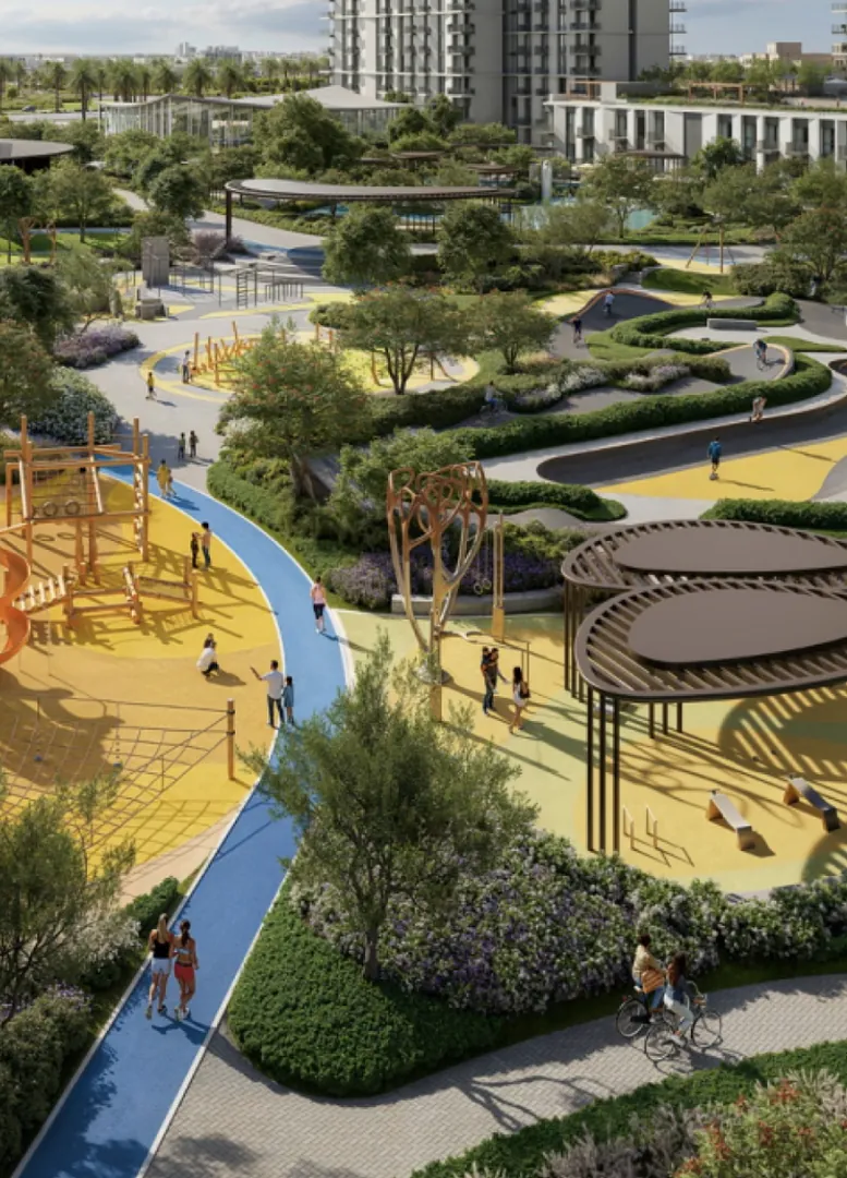 A landscaped park with a running track between the buildings