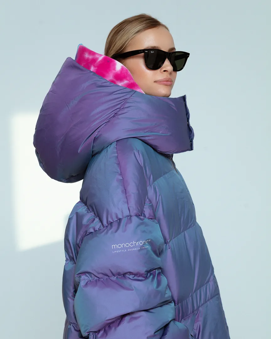 A model in an iridescent MONOCHROME × Reebok puffer
