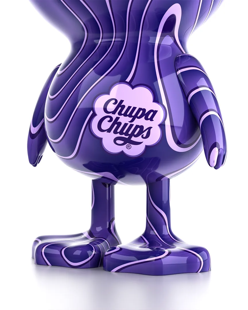 A close view of the purple figure and the Chupa Chups logo