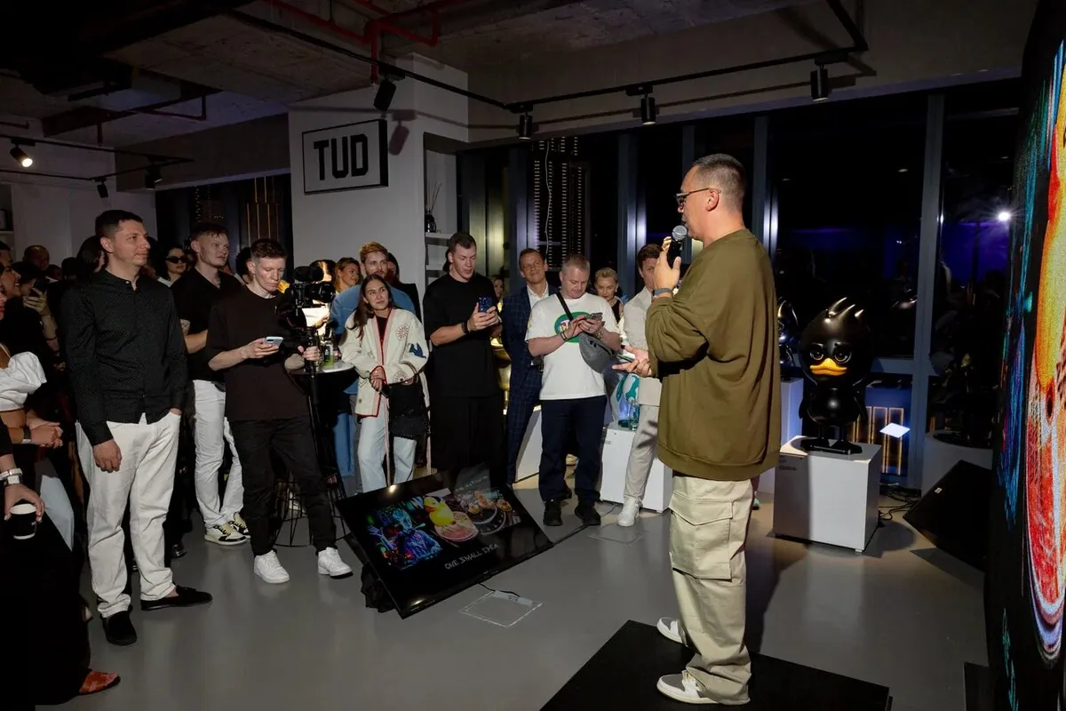 Guests listening to a speech at the gallery opening