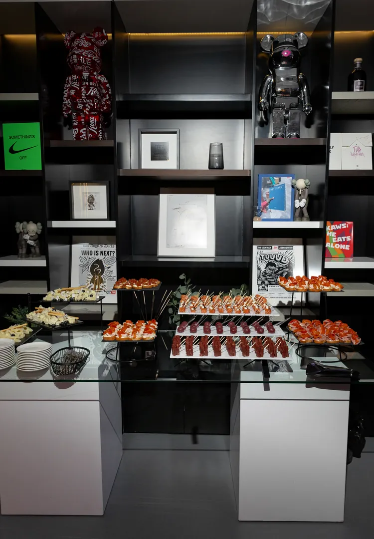 The gallery shelves of collectibles above the catering